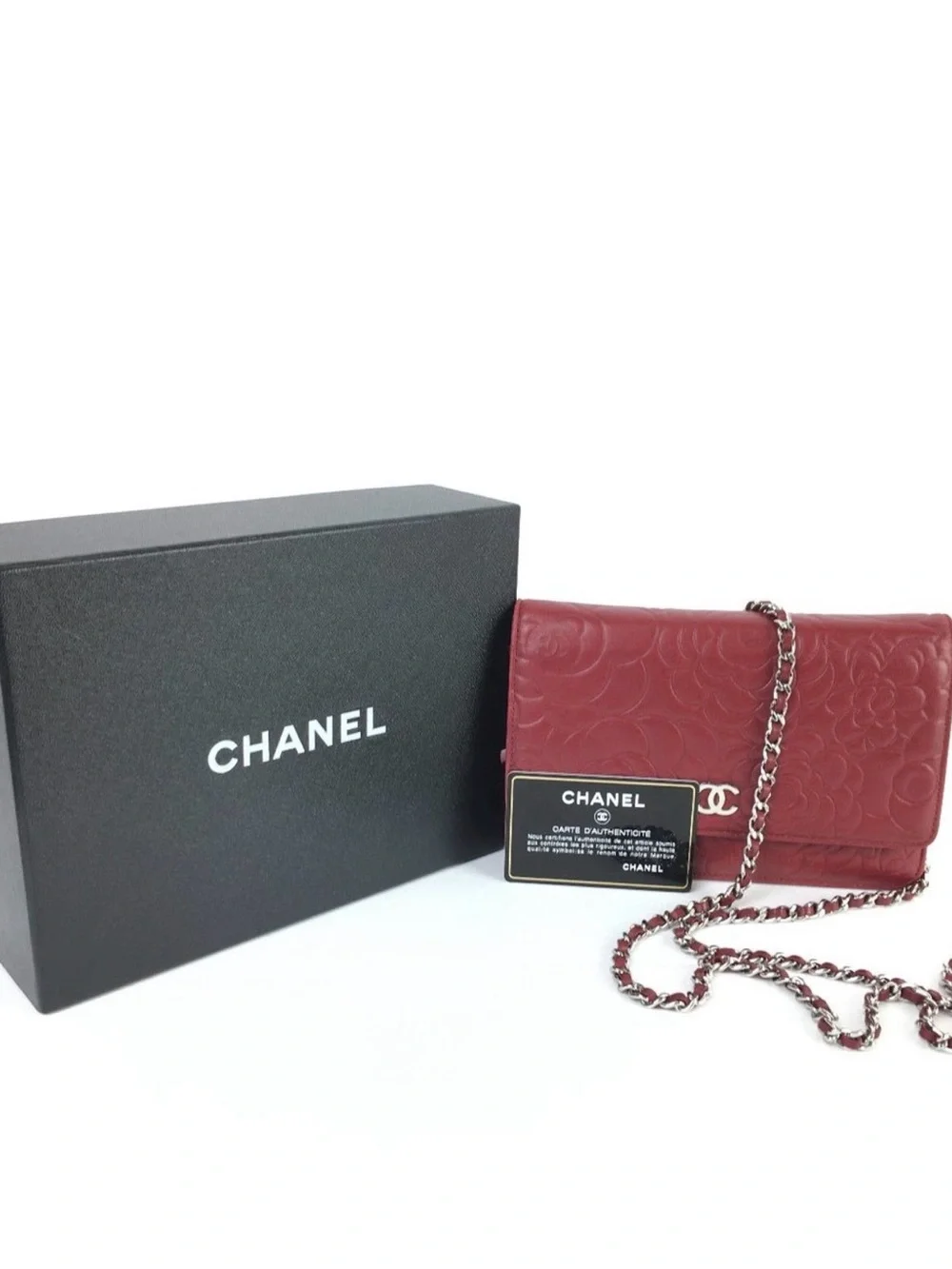 CHANEL Camellia-Embossed Leather Clutch in Deep Red with Silver CC